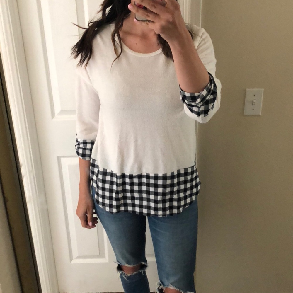 White sweater with black and white detailing
